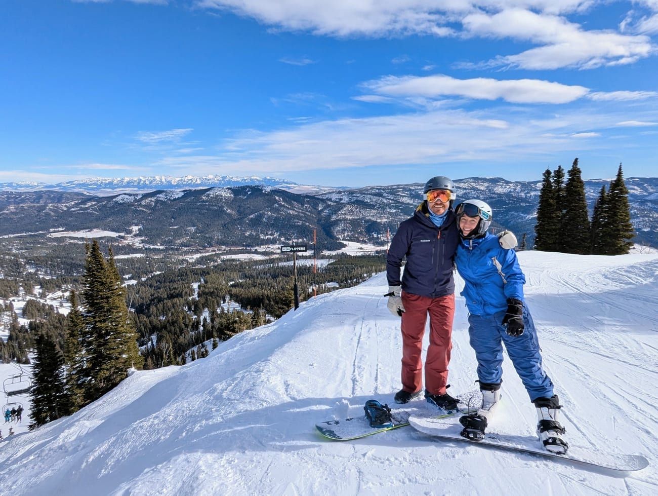 David and Lauren on a snowy mountain summit