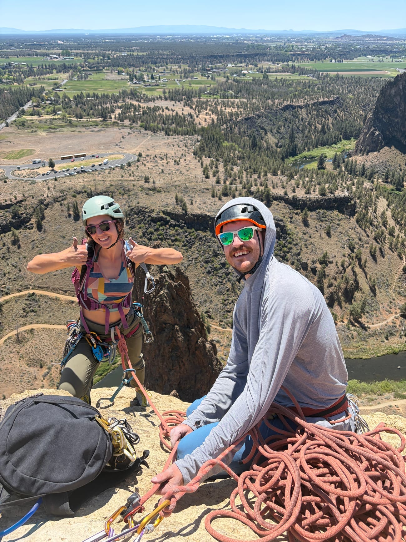 David and Lauren rock climbing on a cliff
